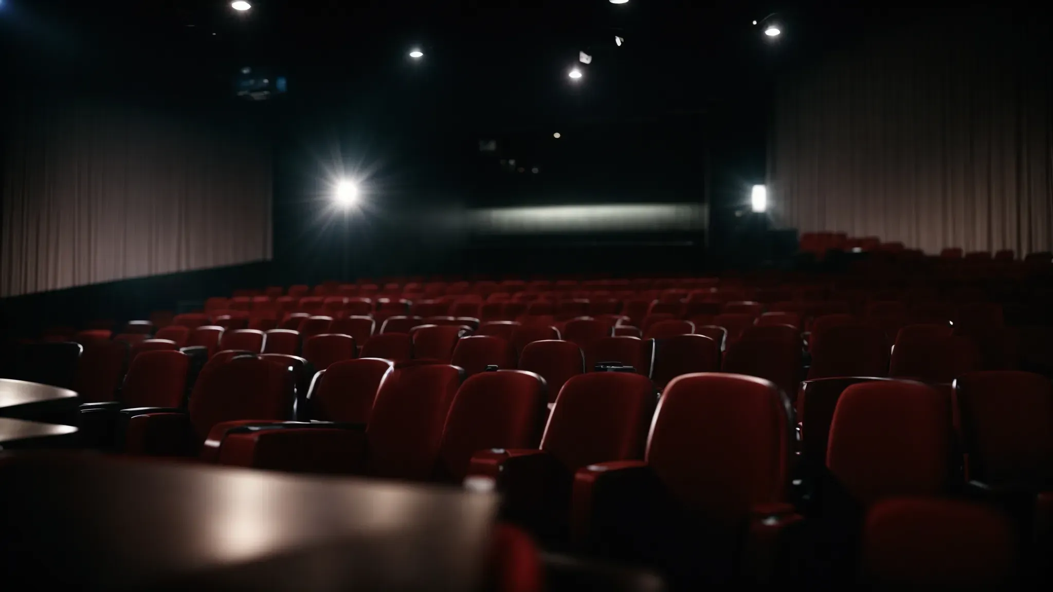 a dimly lit movie theater, where the screen illuminates thoughtful faces, lost in the grip of these compelling narratives.