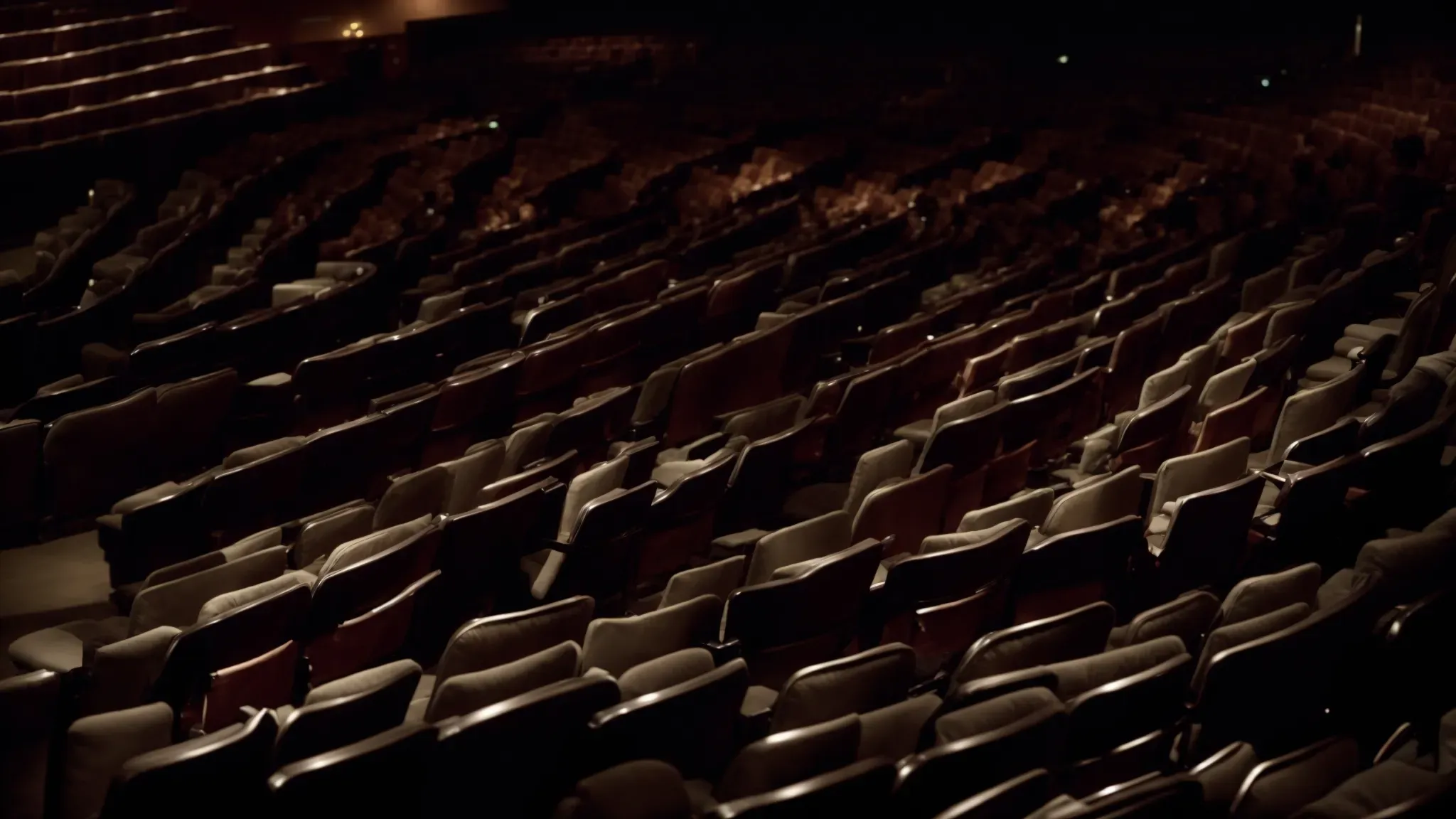 a dimly lit room filled with rows of cinema seats facing a large screen showcasing classic film scenes.