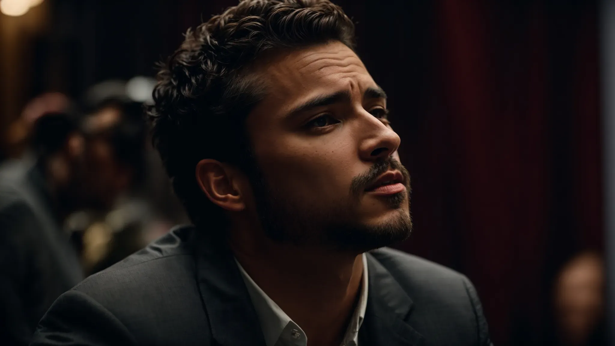 a focused actor on stage embodies a compelling character, captivating the audience in a dramatic performance.