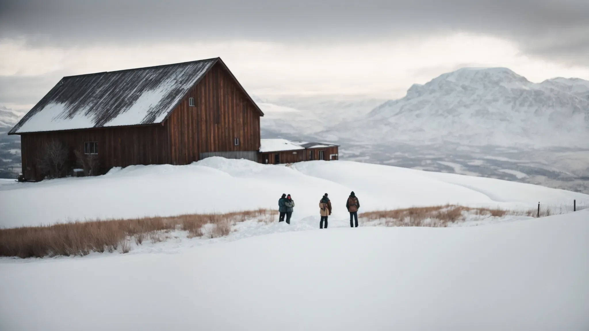 a group of friends stands in front of a cozy cabin, surrounded by a vast, snow-covered landscape, unaware of the horror that awaits.
