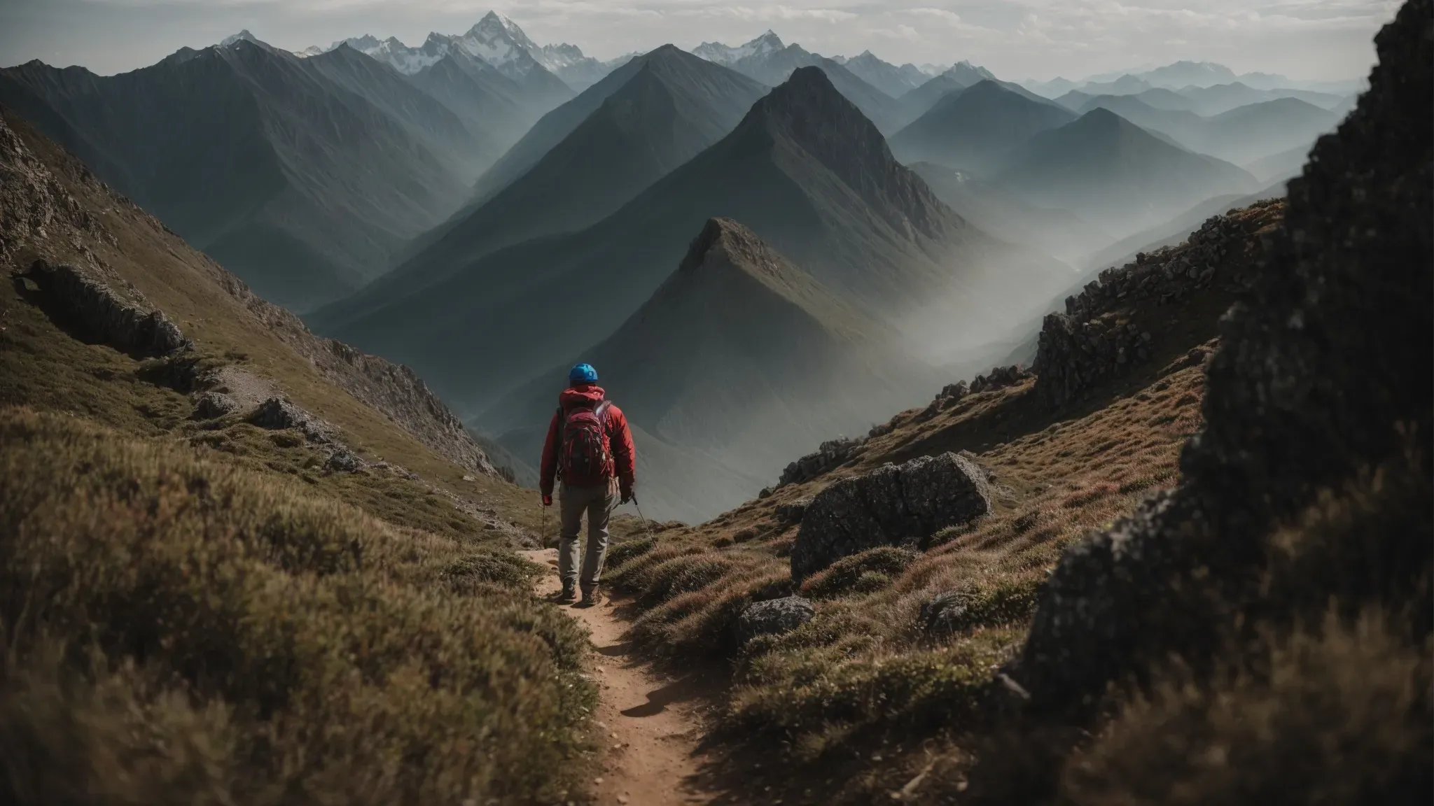 a person ascending a mountain trail towards the peak, symbolizing the journey to creative direction mastery through real-world challenges.
